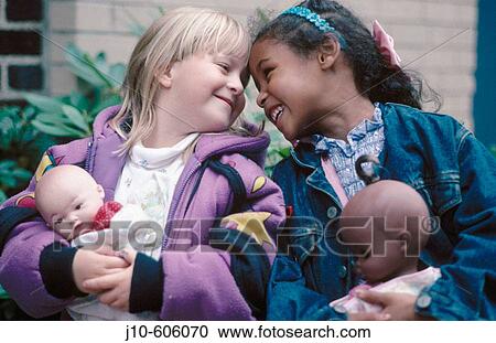Two girls, white and black, with dolls, Boston, MA View Large Photo Image Stock Image - Two girls, white and black, with dolls, Boston, MA. Fotosearch