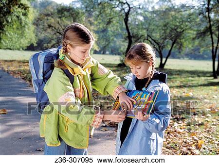 Two girls with pencils View Large Photo Image Stock Photography - Two girls with pencils. Fotosearch