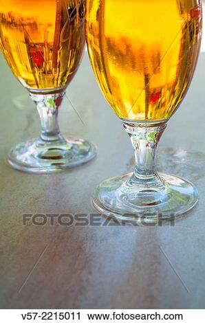 Stock Image - Two glasses of beer, close view.. Fotosearch