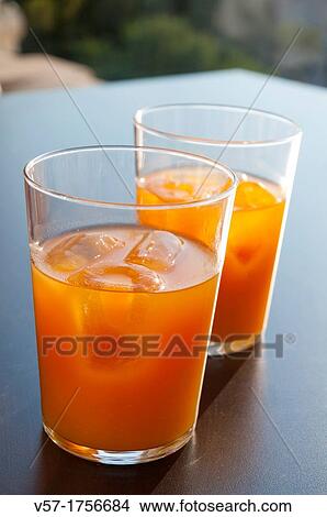 Two glasses of peach juice View Large Photo Image Picture - Two glasses of peach juice. Fotosearch