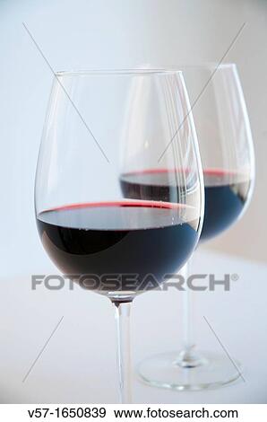 Two glasses of red wine. Close view. View Large Photo Image Stock Photo - Two glasses of red wine. Close view.. Fotosearch