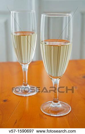 Two glasses of white wine View Large Photo Image Stock Photo - Two glasses of white wine. Fotosearch