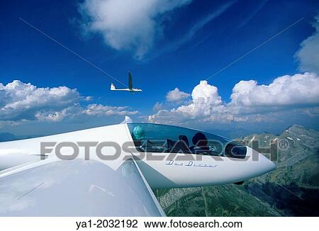 Two glider planes Duo Discus flying over Pyrenees mountains, north of Jaca, Aragon, Spain. View Large Photo Image Stock Image - Two glider planes Duo Discus flying over Pyrenees mountains, north of Jaca, Aragon, Spain.. Fotosearch