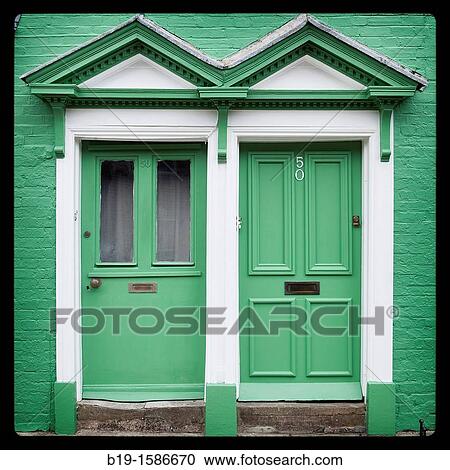 Two gren doors in a green wall, Arundel, England, Europe View Large Photo Image Stock Image - Two gren doors in a green wall, Arundel, England, Europe. Fotosearch