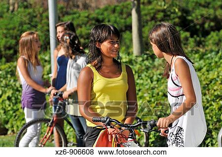 two groups of girls talking to them View Large Photo Image Stock Photo - two groups of girls talking to them. Fotosearch