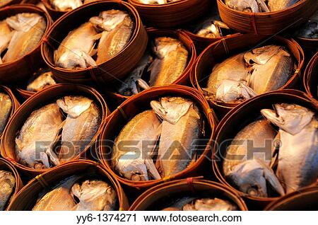 Stock Image - two head fish on display, also known as Pla thu a kind of mackerel is often eaten together with nam phrik kapi, klong toey klong toei market, bangkok, thailand. Fotosearch