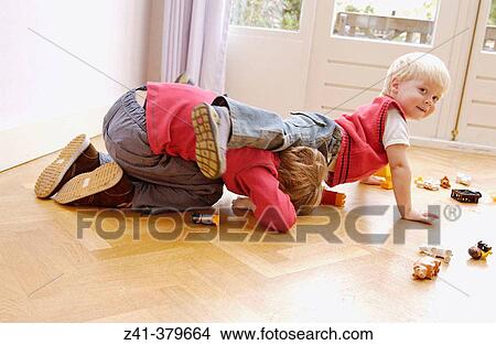 Two little boys playing together View Large Photo Image Picture - Two little boys playing together. Fotosearch