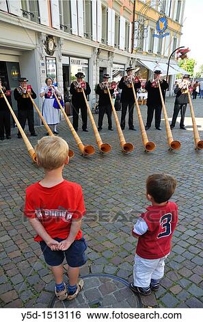 two little boys watching group of players on traditional alpine horns, Vevey, Vaud, Switzerland View Large Photo Image Stock Photograph - two little boys watching group of players on traditional alpine horns, Vevey, Vaud, Switzerland. Fotosearch