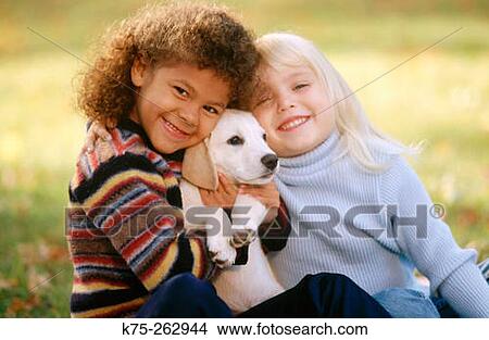 Two little girls with a puppy View Large Photo Image Picture - Two little girls with a puppy. Fotosearch