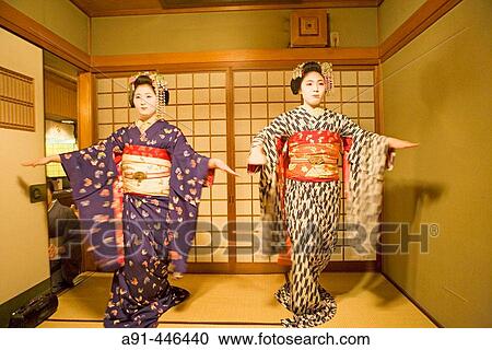 Two? maikos? (geisha apprentice) from the Odamoto tea house (o-chaia) in Gion dancing, Kyoto. Kansai, Japan View Large Photo Image Stock Image - Two? maikos? (geisha apprentice) from the Odamoto tea house (o-chaia) in Gion dancing, Kyoto. Kansai, Japan. Fotosearch