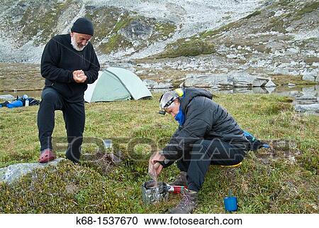 two male campers, cooking in the Cayoosh Range of the Coast Mountains, British Columbia, Canada, near Downton Creek View Large Photo Image Stock Image - two male campers, cooking in the Cayoosh Range of the Coast Mountains, British Columbia, Canada, near Downton Creek. Fotosearch