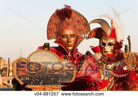 Stock Photo - Two masked persons at the carnival in Venice, Italy, Europe. Fotosearch