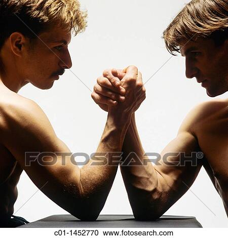 Two men arm wrestling View Large Photo Image Stock Image - Two men arm wrestling. Fotosearch