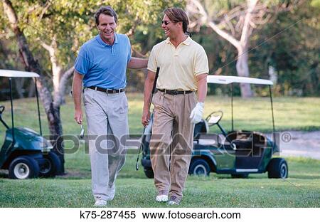 Two men at golf course View Large Photo Image Stock Photography - Two men at golf course. Fotosearch