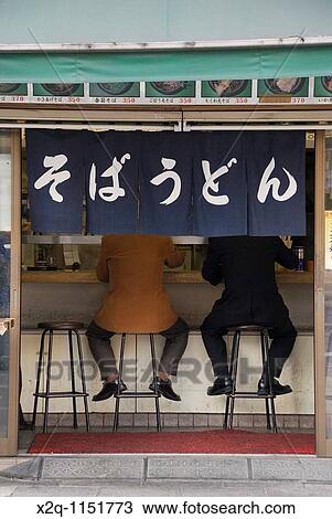Two men eating soba udon at a restaurant Tokyo Japan View Large Photo Image Stock Image - Two men eating soba udon at a restaurant Tokyo Japan. Fotosearch