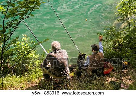 Two men fishing in Lake Bled, Slovenia View Large Photo Image Stock Photograph - Two men fishing in Lake Bled, Slovenia. Fotosearch