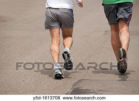 two men in shorts running the street, legs only, Geneva, Switzerland View Large Photo Image Stock Photo - two men in shorts running the street, legs only, Geneva, Switzerland. Fotosearch