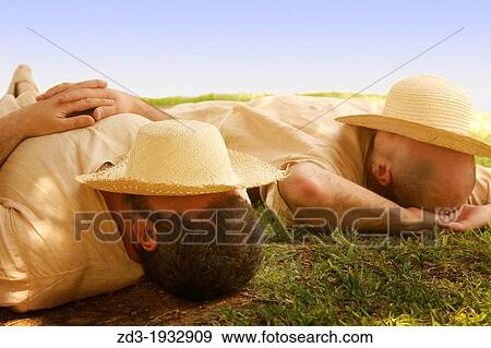 Two men in sleeping during siesta time in Valencia, Spain View Large Photo Image Stock Photo - Two men in sleeping during siesta time in Valencia, Spain. Fotosearch