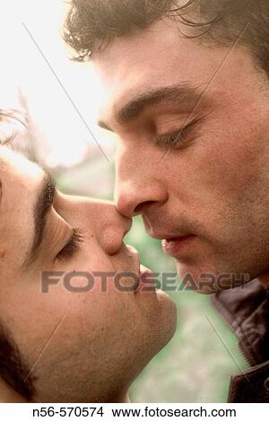 Picture - Two men kissing. Fotosearch