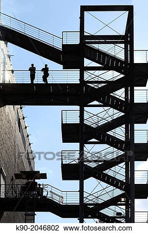 Two men on emergency stairs, Essen, Northrine-Westphalia, Germany, Europe View Large Photo Image Stock Image - Two men on emergency stairs, Essen, Northrine-Westphalia, Germany, Europe. Fotosearch