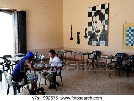 Two men playing chess at cafe in Santa Clara, Villa Clara Province, Cuba View Large Photo Image Stock Photography - Two men playing chess at cafe in Santa Clara, Villa Clara Province, Cuba. Fotosearch