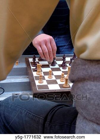 two men playing chess game outdoors View Large Photo Image Stock Image - two men playing chess game outdoors. Fotosearch