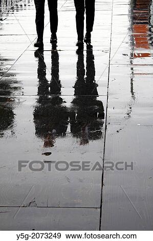 two men walking on wooden floor boards in city town View Large Photo Image Stock Photo - two men walking on wooden floor boards in city town. Fotosearch