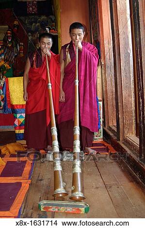 Two monks playing their traditional trumpet, Bhutan View Large Photo Image Picture - Two monks playing their traditional trumpet, Bhutan. Fotosearch