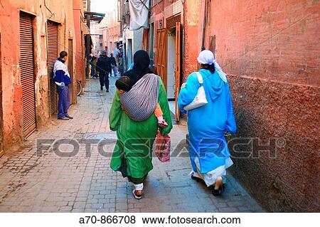 Two Muslim inside in a lane of Marrakesch, Morocco View Large Photo Image Stock Photo - Two Muslim inside in a lane of Marrakesch, Morocco. Fotosearch