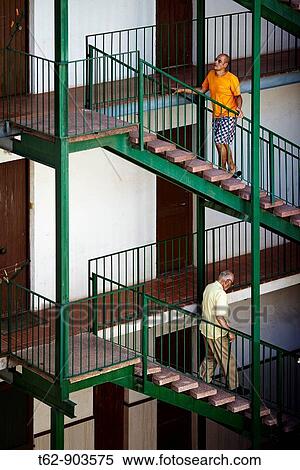 Two neighbors on the stairs View Large Photo Image Stock Photography - Two neighbors on the stairs. Fotosearch