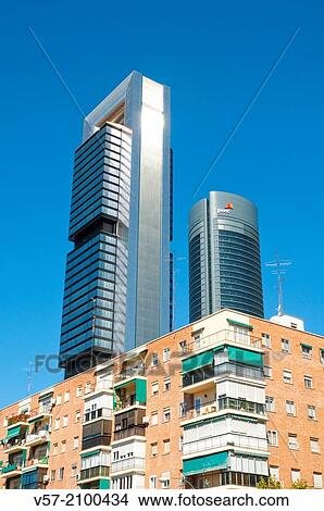 Two of the Four Towers contrasting with tenements. Madrid, Spain. View Large Photo Image Picture - Two of the Four Towers contrasting with tenements. Madrid, Spain.. Fotosearch