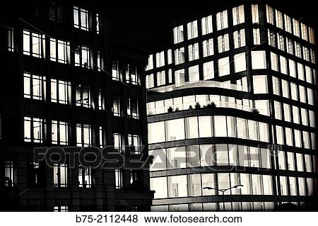 Two office buildings at night with the lights on in the City of London, England, UK, Europe. View Large Photo Image Stock Photo - Two office buildings at night with the lights on in the City of London, England, UK, Europe.. Fotosearch