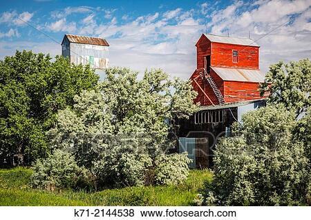 Two old abandoned grain elevators near Zurich, Montana, USA. View Large Photo Image Stock Photo - Two old abandoned grain elevators near Zurich, Montana, USA.. Fotosearch