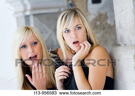 Two pretty girls are wondering View Large Photo Image Stock Image - Two pretty girls are wondering. Fotosearch