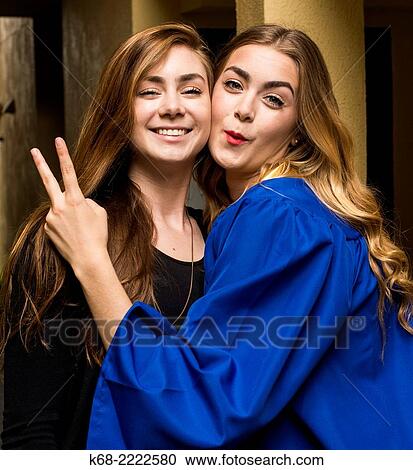 two sisters, 18 and 22, at a graduation ceremony. View Large Photo Image Stock Image - two sisters, 18 and 22, at a graduation ceremony.. Fotosearch