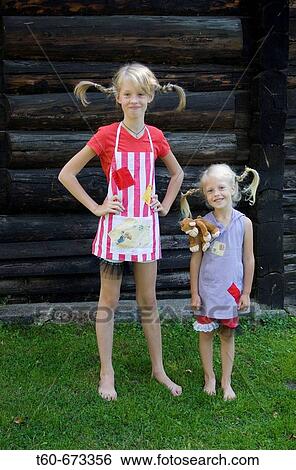 Two sisters with braids in their hair, costume party theme. View Large Photo Image Stock Photograph - Two sisters with braids in their hair, costume party theme.. Fotosearch