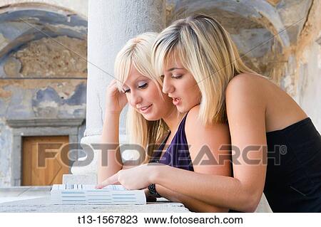Two student women are teaching View Large Photo Image Stock Image - Two student women are teaching. Fotosearch