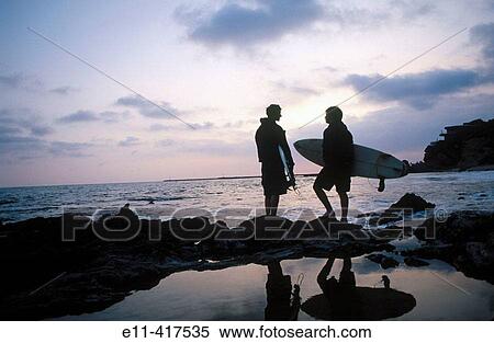 Two surfers at tide pools. View Large Photo Image Stock Photography - Two surfers at tide pools.. Fotosearch