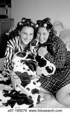 Two teen girls talk on phone View Large Photo Image Stock Photo - Two teen girls talk on phone. Fotosearch