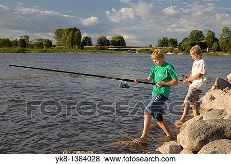 Two Teenage Boys Fishing on Pier by Lake V? rtsj? rv in Estonia View Large Photo Image Stock Photo - Two Teenage Boys Fishing on Pier by Lake V? rtsj? rv in Estonia. Fotosearch