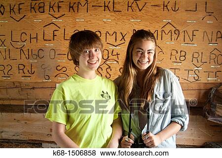 two teenage girls in front of a plaque of cattle brands in the Pincher Creek, Alberta, Canada museum View Large Photo Image Stock Photo - two teenage girls in front of a plaque of cattle brands in the Pincher Creek, Alberta, Canada museum. Fotosearch