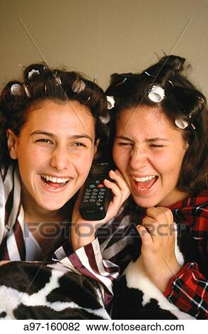 Two teenage girls on phone View Large Photo Image Stock Image - Two teenage girls on phone. Fotosearch