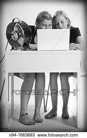 Two teenage girls studying Central European and laptop front. View Large Photo Image Stock Image - Two teenage girls studying Central European and laptop front.. Fotosearch