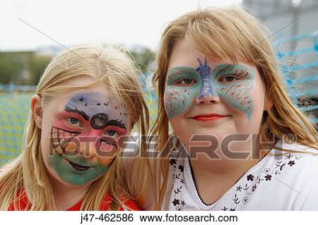 Two teenage girls with their faces painted, smiling into camera View Large Photo Image Stock Photograph - Two teenage girls with their faces painted, smiling into camera. Fotosearch