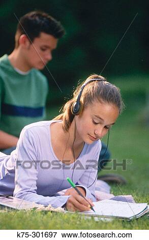 two teenagers studying outdoors View Large Photo Image Stock Photo - two teenagers studying outdoors. Fotosearch