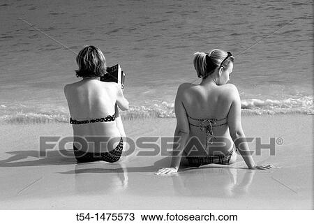 Two tourist enjoying the day on Chaweng Beach in Ko Samui View Large Photo Image Stock Image - Two tourist enjoying the day on Chaweng Beach in Ko Samui. Fotosearch