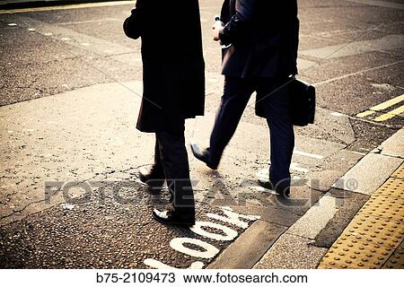 Two unrecognizable executives across a street with a briefcase. London, England, UK View Large Photo Image Stock Image - Two unrecognizable executives across a street with a briefcase. London, England, UK. Fotosearch