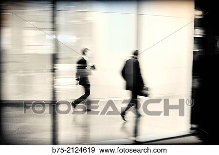 two unrecognizable executives male walking down the hall of an office building in the City of London, England, UK, Europe. View Large Photo Image Stock Photo - two unrecognizable executives male walking down the hall of an office building in the City of London, England, UK, Europe.. Fotosearch