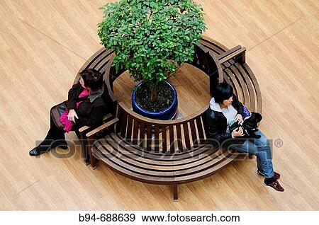 Two woman sitting at Diagonal Mar shopping mall, Barcelona. Catalonia, Spain View Large Photo Image Stock Photo - Two woman sitting at Diagonal Mar shopping mall, Barcelona. Catalonia, Spain. Fotosearch