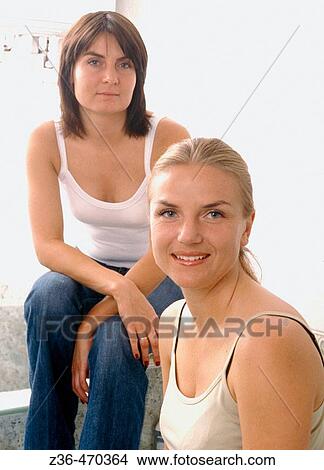 Picture - Two woman together. Fotosearch